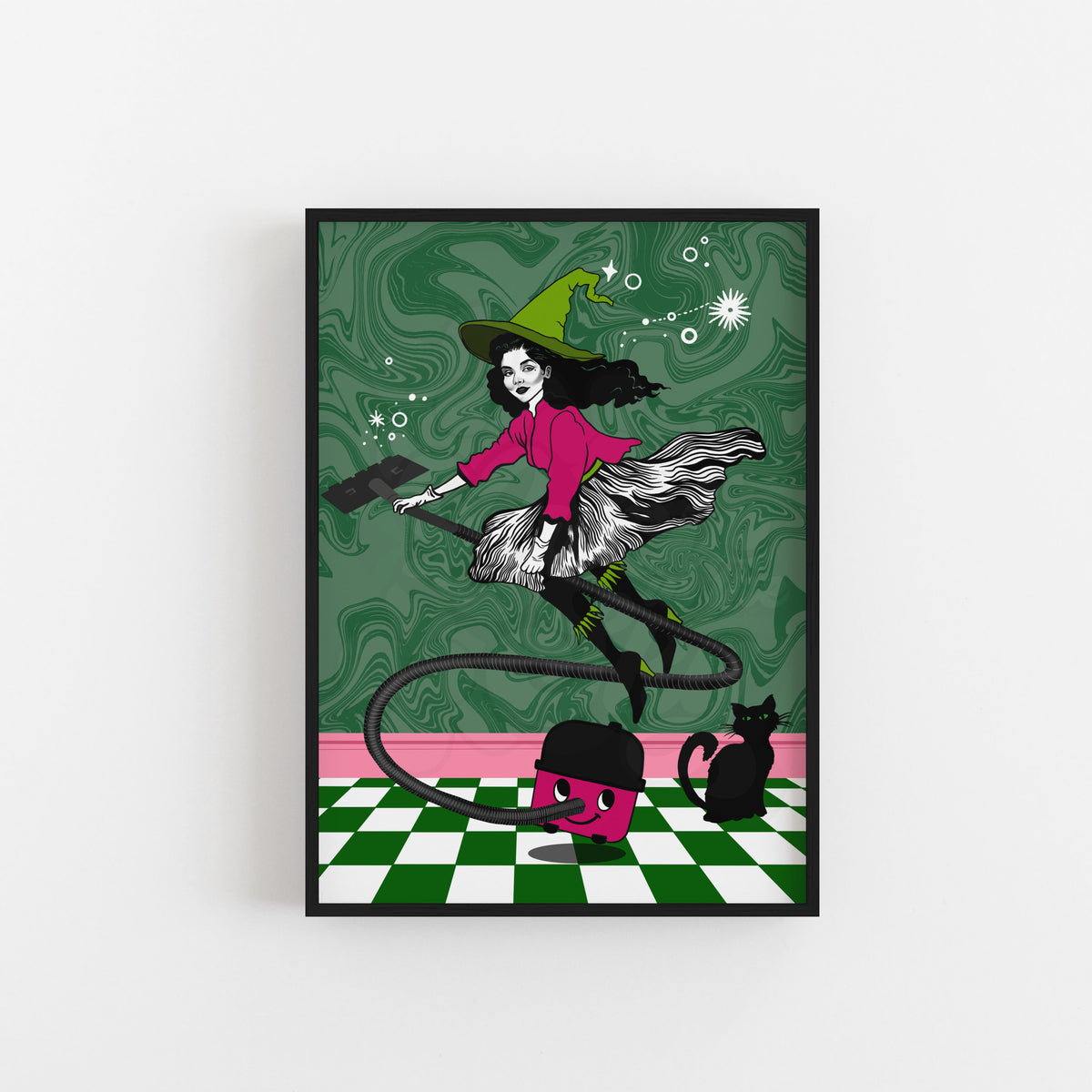 A framed art print featuring a whimsical illustration of a witch riding a Henry Hoover against a green marbled background, with a black cat on a green-and-white checkered floor. The print is shown hanging on a light gray wall.