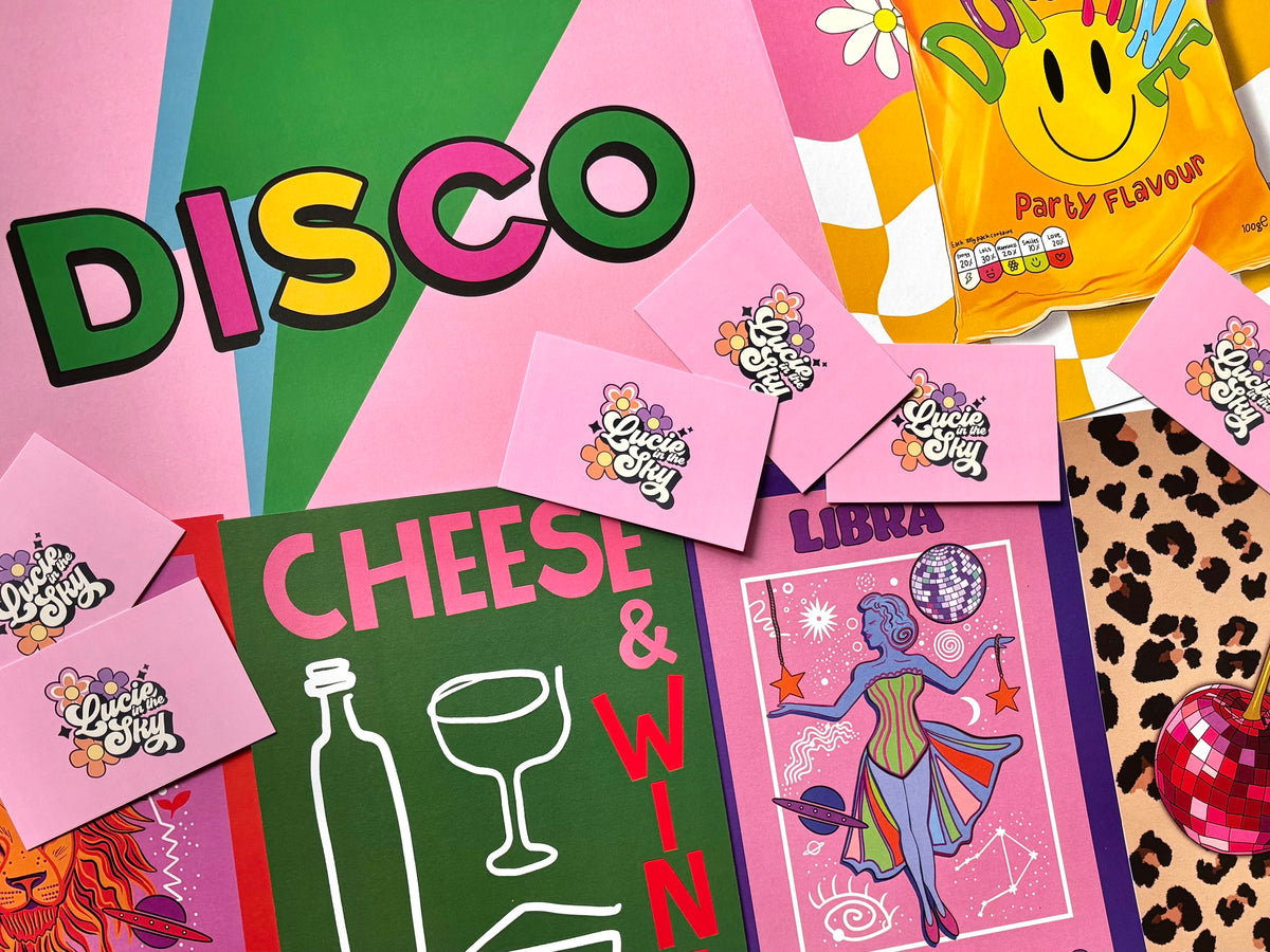 Colourful art prints by Lucie In The Sky featuring a bold DISCO typography print, Cheese & Wine illustration, pink Libra zodiac art and vibrant retro designs with disco balls and playful details.