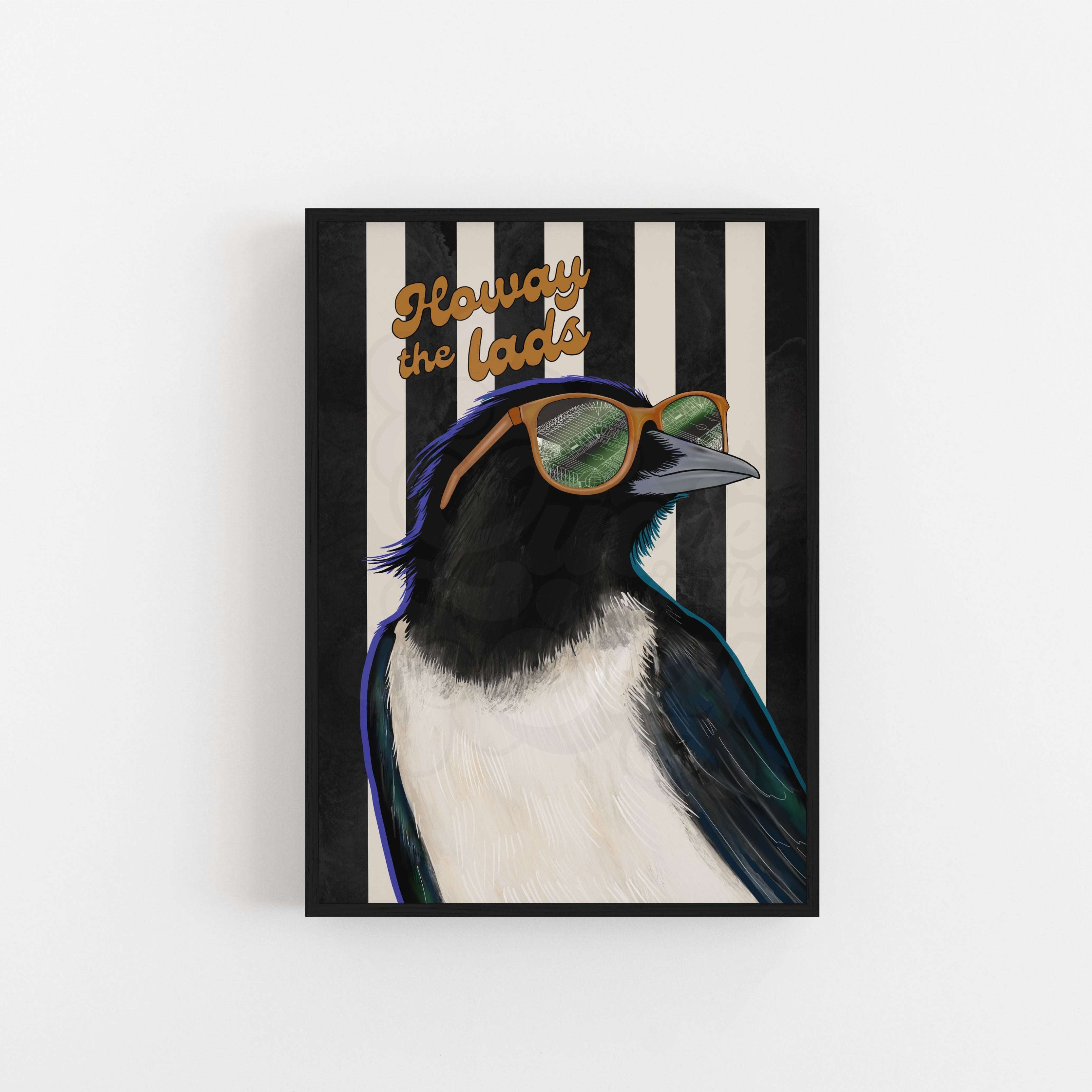 Framed artwork of a magpie wearing sunglasses with text on a striped background reading "Howay the Lads"