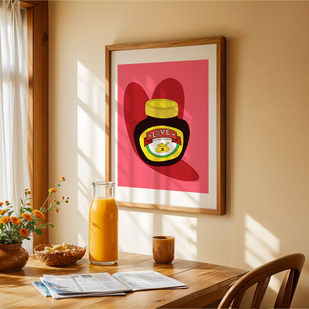 Love marmite print on the wall in a kitchen with a table and orange juice