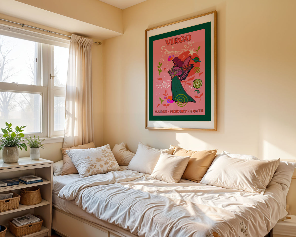 A framed art print featuring a colorful Virgo poster hangs on a beige wall above a bed with white and tan bedding in a sunlit bedroom.