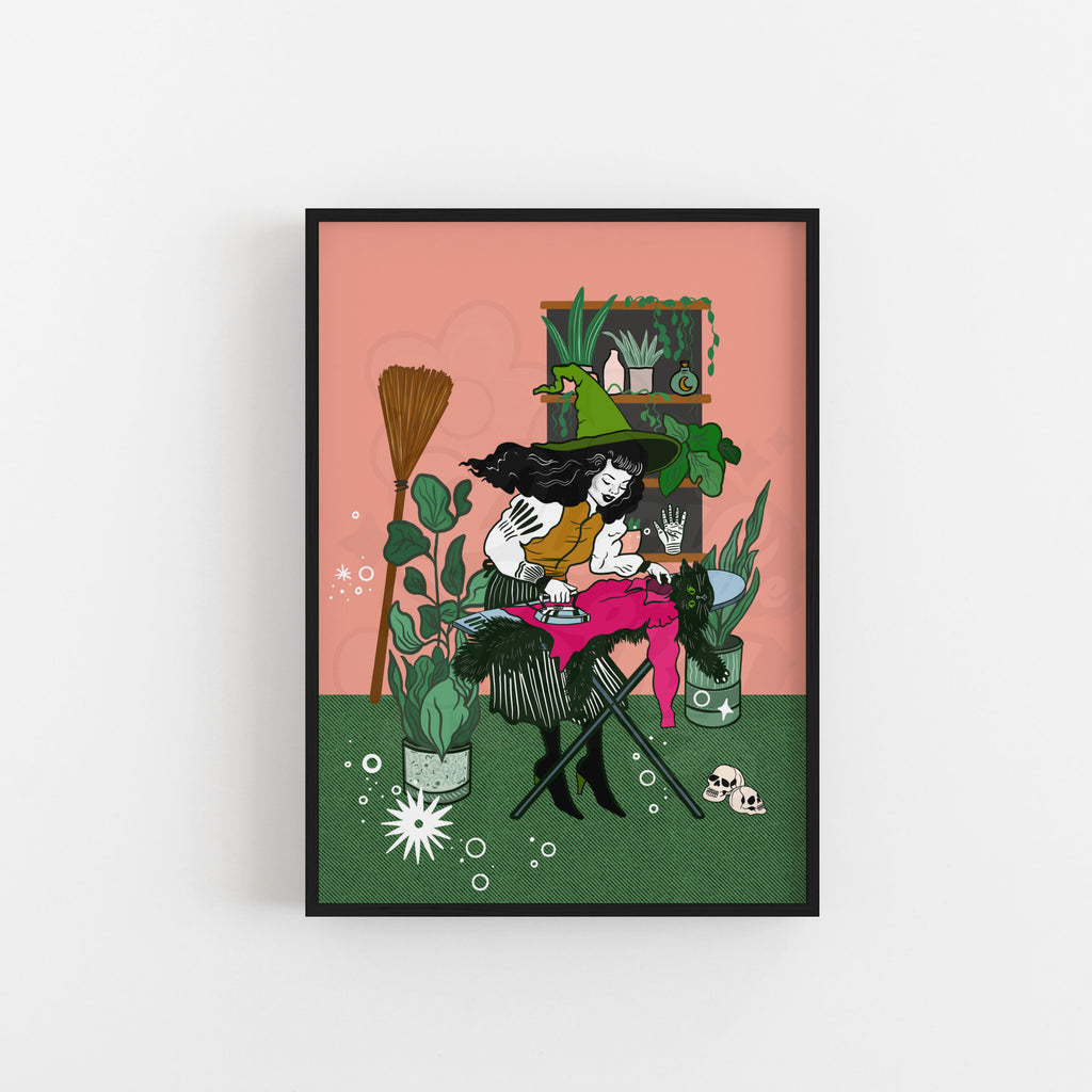 Colourful witch ironing her cat illustration art print, featuring playful magical details, house plants and quirky retro-inspired artwork.