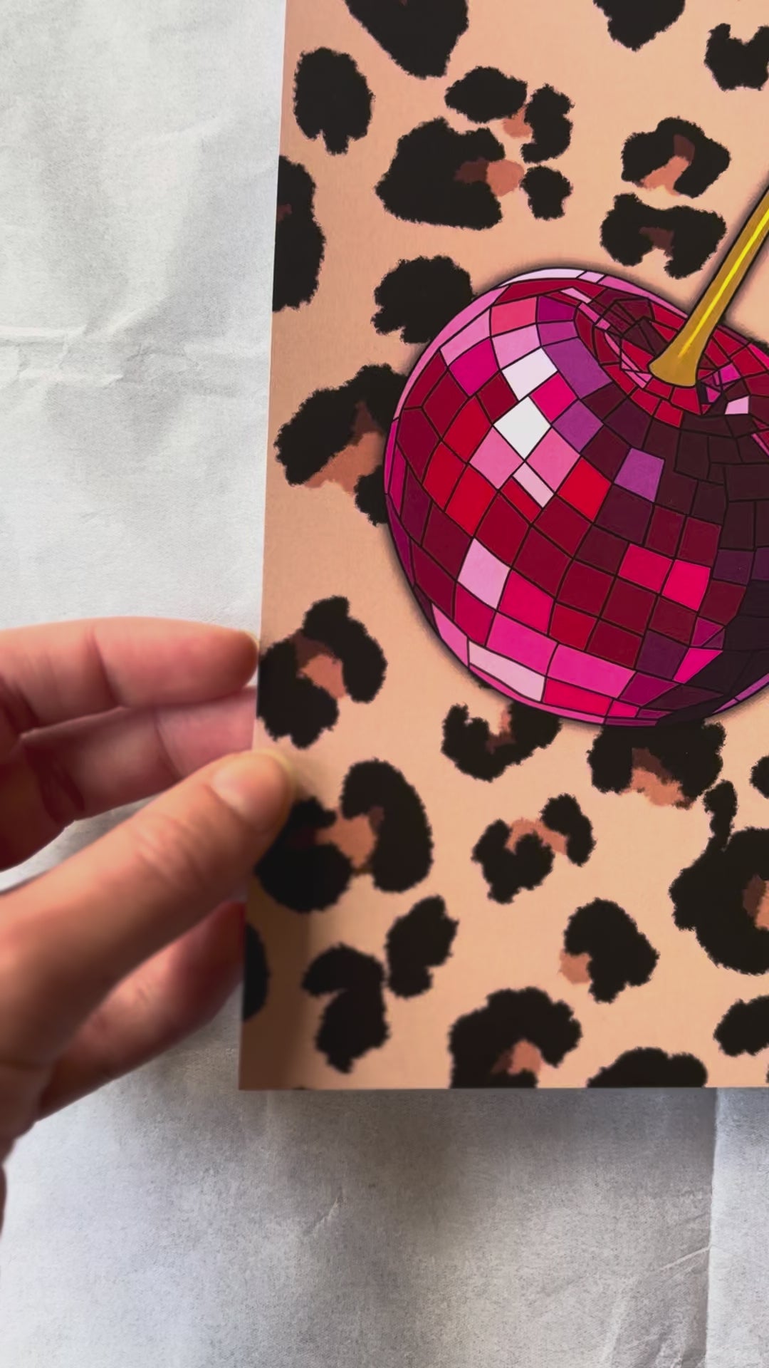 Video showing a close up of the disco cherries with leopard background print